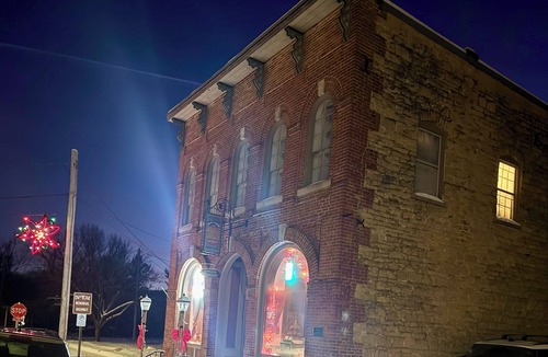 Spillville Apartment | Room 1: Sleep Where Prohibition Secrets Were Made - Historic Escape!