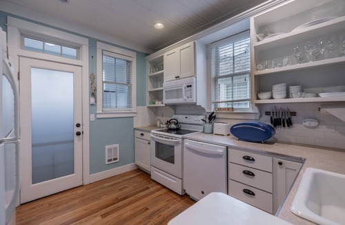 Seabrook House | Seabrook's Cape Escape a cozy 2-bedroom home with a covered porch!