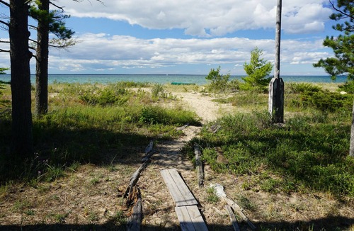 Cheboygan Cabin | Secluded Beach Front Log Cabin Next to Nature Preserve
