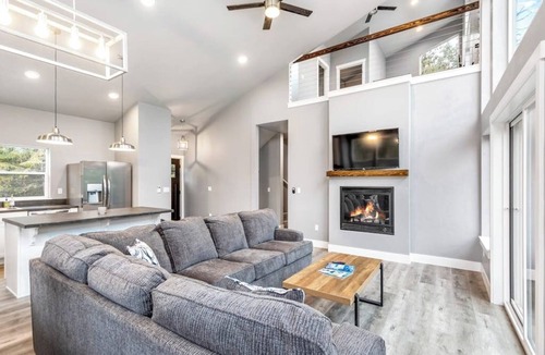 Sandpoint House | Secluded home with deck, grill, hot tub, fireplace, private beach, & W/D