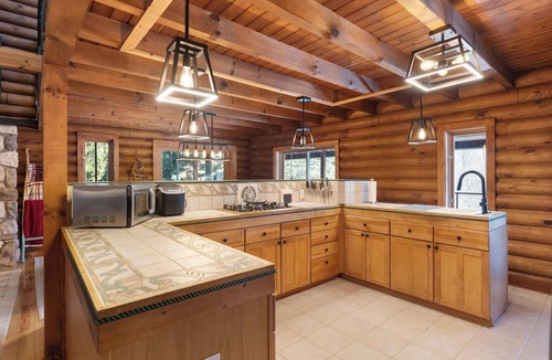 Charlevoix Ski Chalet | Secluded, log cabin chalet 16+ custom outdoor fire pit, air hockey, 2 hot tubs!