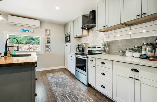 Fish Haven House | Single-level, lakefront getaway with mini-bar, furnished deck & mountain views