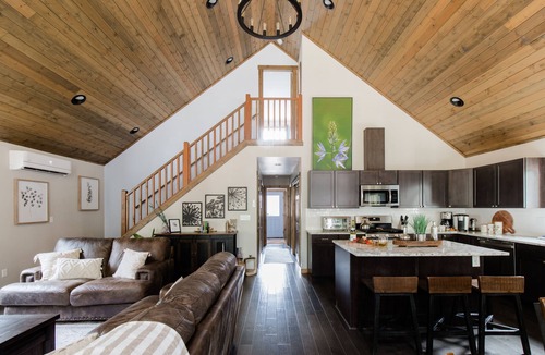 Ronald Cabin | Sleeps 11 across 3 bedrooms, every bed a real one. Hot tub, full kitchen, game room with 100 DVDs and Skee Ball, fast wifi, and a big fenced yard backed by pines. Five minutes to Roslyn and Lake Cle Elum. Forty-five minutes to Snoqualmie Pass.
