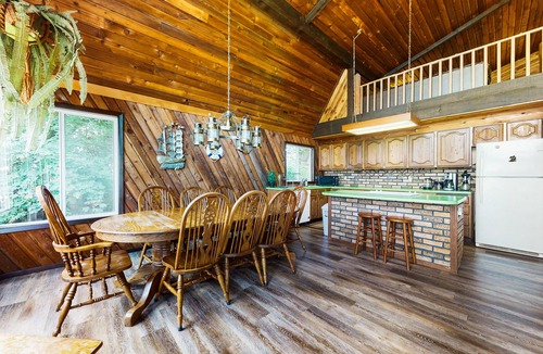 Anderson Island House | Sound view home full of vintage charm with game room, wood stove, & gas grill