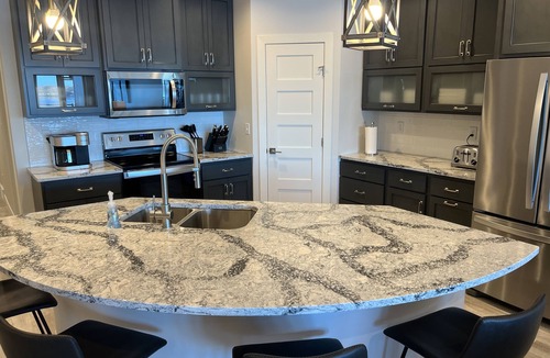 Arnolds Park Condo | Spacious 4 Bedroom Lakefront Luxury. Panoramic Views & 6 waterpark passes at BB.