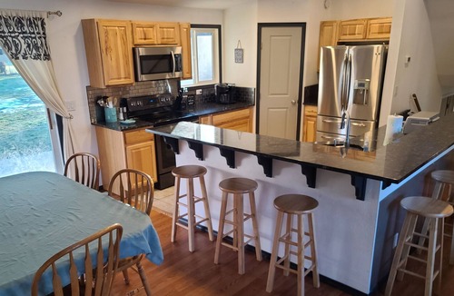 Veradale House | Spacious 5-bedroom residential home with fire pit