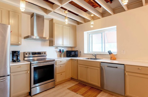 Roseville Apartment | Spacious modern loft with a city view.