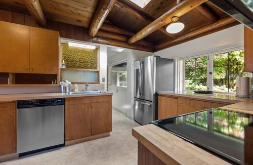 Lawton Park House | Storybook Log House with Waterfront and Fireplace