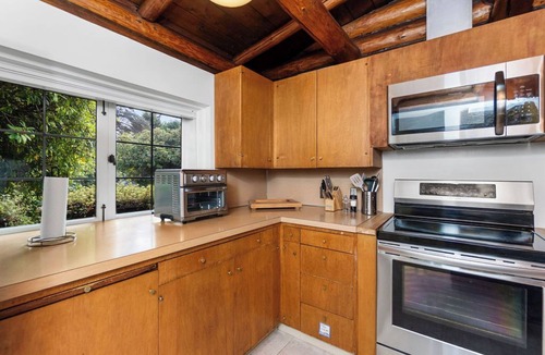 Lawton Park House | Storybook Log House with Waterfront and Fireplace