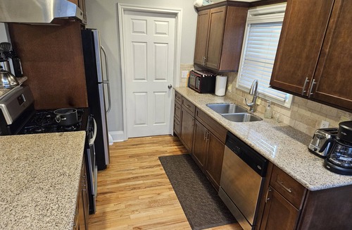 Woodstock House | Super clean and cute bungalow. Hot tub. 2 beds 1 bath. Fully fenced backyard ...