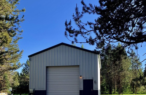 Wagon Wheel House | The Barndominium 167 with a Hot Tub on a 1/2 acre
