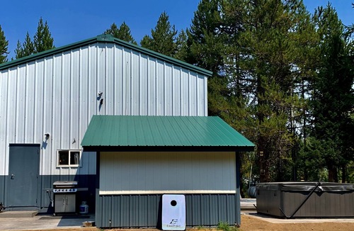 Wagon Wheel House | The Barndominium 167 with a Hot Tub on a 1/2 acre