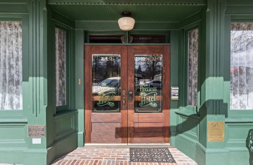 Historic Railroad District Apartment | The Peerless Hotel | Anniversary Suite #3 | Twin Soaking Tubs | Historic District