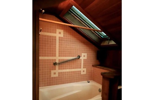 Medford Apartment | The Rose master bedroom at the Wisteria Cottage