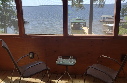 Negreet Cabin | Tiny Toledo - Lakefront Cabin with Boathouse, Fishing Pier, and DRAMATIC Sunsets
