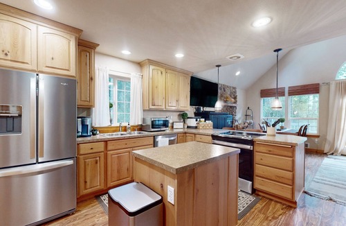 Anderson Island House | Tree-lined Anderson Island home with porch & fenced yard, near dock/tennis