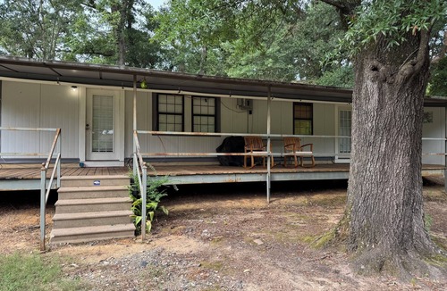 Fairbanks House | Unique camp style house with large wrap around deck.