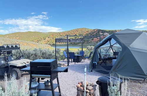 Laketown RV Rental | Unplug and unwind in our secluded off-grid glamping dome, nestled by a private lake. Enjoy the peace and quiet with all the comforts of home