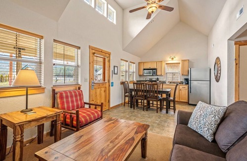 Dover Bay House | Unwind at Fish Tales Bungalow, a charming coastal-style hideaway just steps from the lake. Enjoy resort amenities, trails, and the tranquil Dover Bay setting.