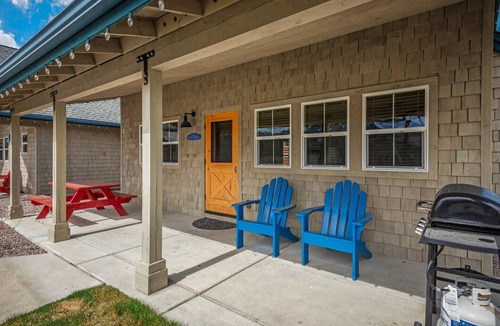 Dover Bay House | Unwind at Fish Tales Bungalow, a charming coastal-style hideaway just steps from the lake. Enjoy resort amenities, trails, and the tranquil Dover Bay setting.