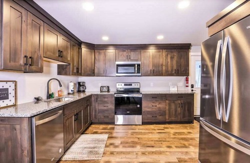 Manitowish Waters House | Updated, tree-lined home on the snowmobile trail with gas fireplace & firepit