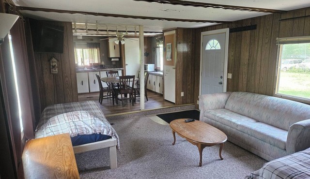 2 BR mobile home with AC that includes dock slip on the Rainy River. Sleeps 8