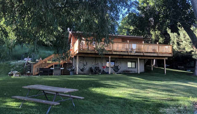 A wonderful, secluded 2 story cabin, deck, fire pit, stocked pond for fishing.