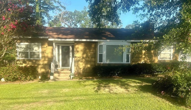 Charming 3-bedroom house with Spacious Backyard! Located in the hub of the city.