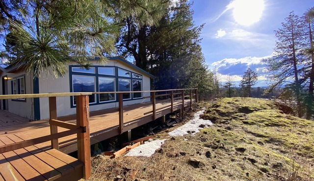 Cliffside retreat with view on 8 forested acres between CDA and Silverwood