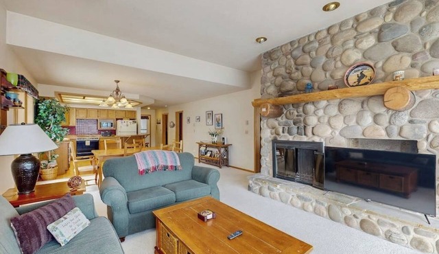 Condo with WiFi, fireplace, hot tub, & swimming pool