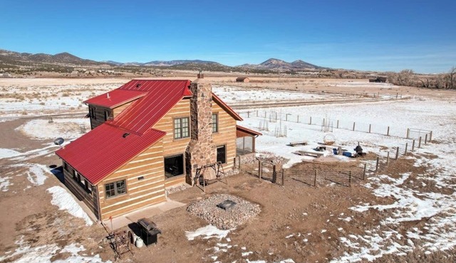 Dog-friendly riverfront retreat with hot tub, stunning views & screened porch