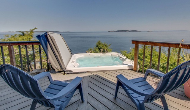 Dog-friendly waterfront home with private hot tub & island views
