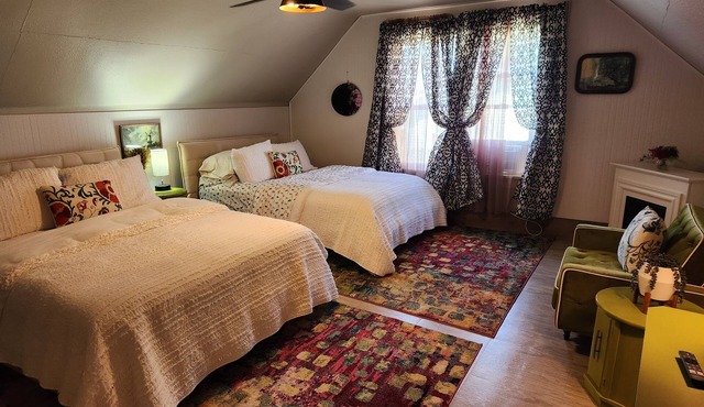 Enjoy the top floor of this victorian house With two suites & a bonus bedroom