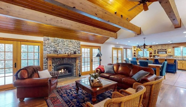 Hilltop Lodge on Hayden Lake | Expansive deck & private dock with stunning views