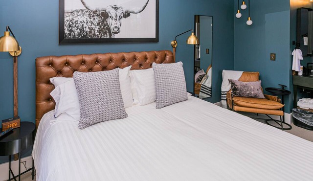 Jacksonville Inn Room #8: King Suite. Prime downtown location for festivals and dining. Comfortable king bed, Nespresso coffee, and historic boutique elegance