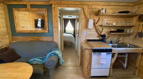 King Suite with a Full Kitchen and Balcony at the Cedaredge Lodge