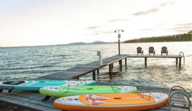 Lakefront retreat w/private dock, SUPs & fast WiFi - walk to restaurants!