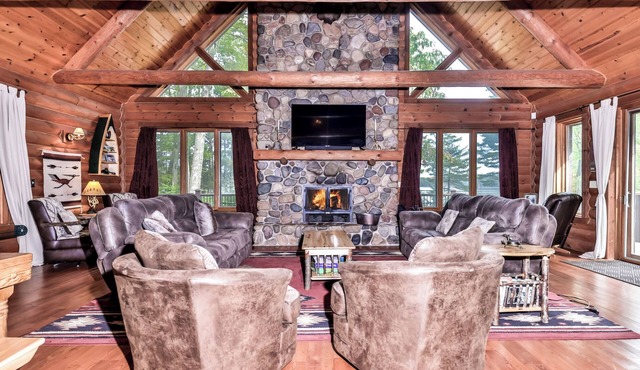 Large lakeside log home with air-hockey, foosball, dock, enclosed porch, firepit in Three Lakes
