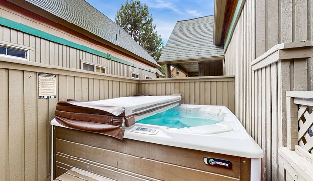 Log decor home with private hot tub, deck & shared pools & tennis
