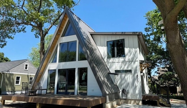 Modern A-frame situated only steps to beautiful Michigan and Muskegon beaches.