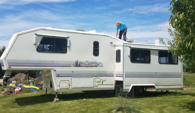 Montana Mountain Memories- RV in Orchard by Trout Pond