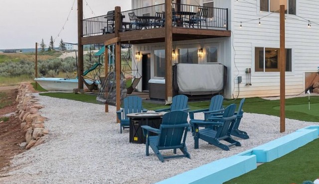 On Hole 9 of Bear Lake Golf Course! Ideal Beach Access! Private Hot Tub. Sky Swings, and Ping Pong!