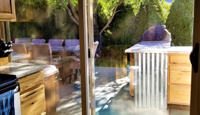 Outdoor kitchen with grill and professional griddle