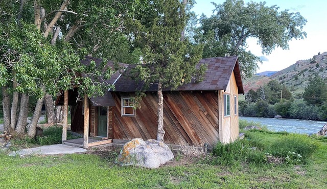 Remodeled Cabin on 40 private acres of Wind River frontage with R/V hookup.