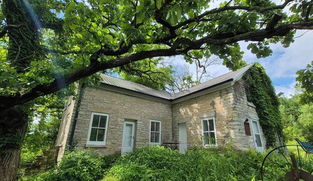 Secluded 1860 Stone House recently remodeled on the Upper Iowa River by Bluffton
