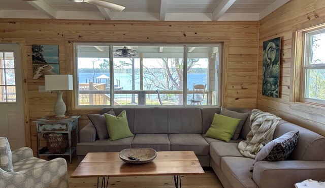 Secluded waterfront fishing cabin, boat dock, pier, sunsets, boat to beach