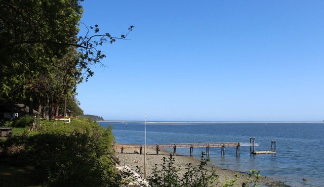 Surrounded by evergreens and overlooking Sequim Bay
