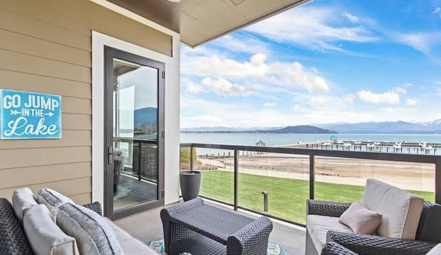 Lake view condo with WiFi, balcony, fireplace, & shared pool/hot tub/grills